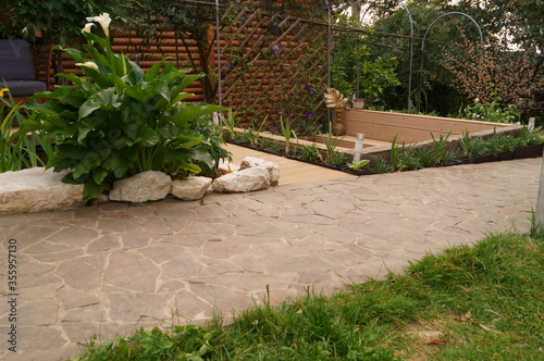 Road or path made of natural stone in the garden. Landscaping and decoration of garden.	