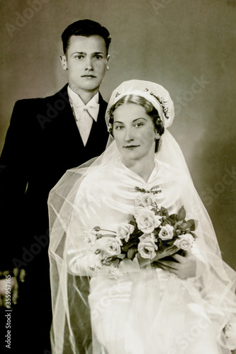 Latvia - CIRCA 1930s: Young married couple in studio. Vintage wedding art deco era photo