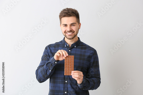 Smiling young man holding l...