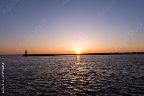 Lighthouse at Warnemünde Port While Sunrise, Rostock, Baltic Sea, Mecklenburg Western Pomerania, Germany, Europe