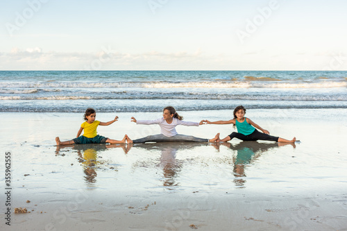 Children friends playing relaxed on the beach on a beautiful day