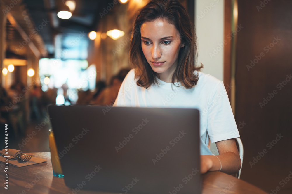 young female manager using laptop in cafe, hipster girl freelancer writing on keyboard, businesswoman working via portable computer, woman student online learning .through internet technology young female manager using laptop in cafe, hipster girl freelancer writing on keyboard, businesswoman working via portable computer, woman student online learning .through internet technology