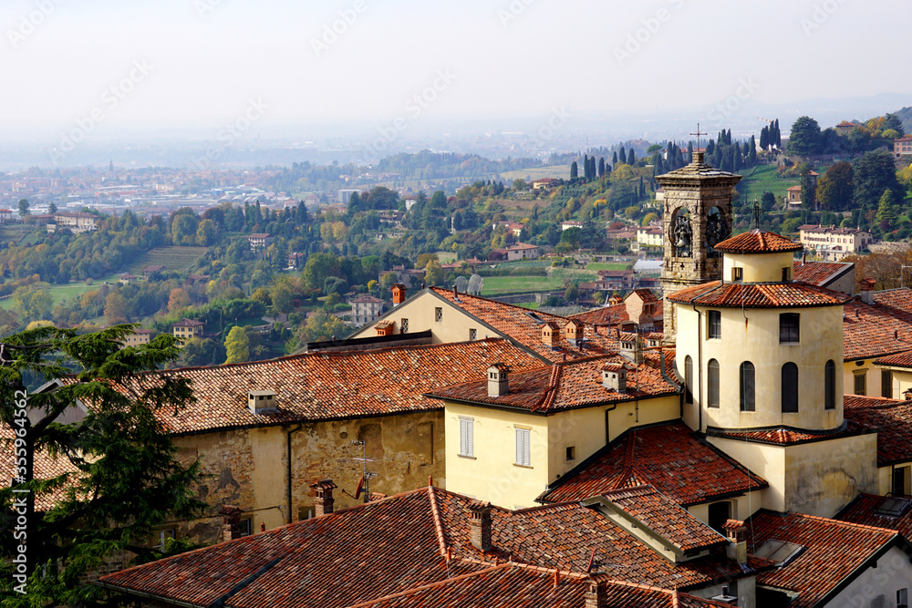 Beautiful panorama view over lombardy landscape with curches and hills from Citta Alta in Bergamo, Italy.