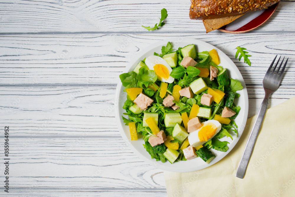 Tuna salad with mix salad leaves, spinach and arugula , cucumber and egg Tuna salad with mix salad leaves, spinach and arugula , cucumber and egg