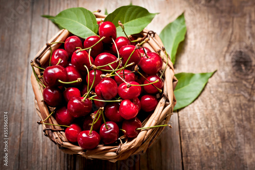 ripe cherries in a wicker basket