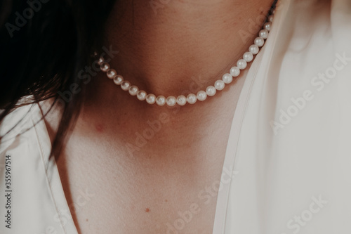 pearl necklace on a girl's neck