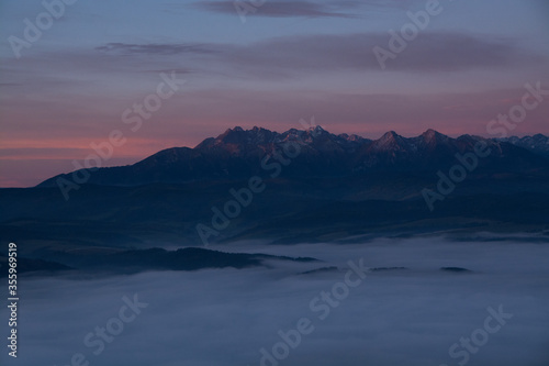 Foggy sunrise in mountains with beautiful colours in Trzy Korony, Malopolskie, Poland.