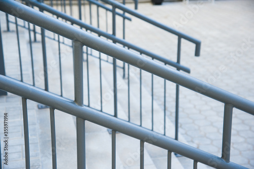 Concrete entrance stairs with metal railings