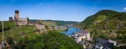 With the bike on the cycle path through the countryside along the river Moselle in Rhineland-Palatinate from Trier to Koblenz in summer