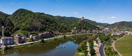 With the bike on the cycle path through the countryside along the river Moselle in Rhineland-Palatinate from Trier to Koblenz in summer