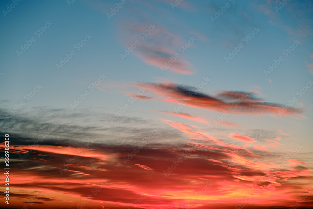 Red sunset on dark blue sky, background