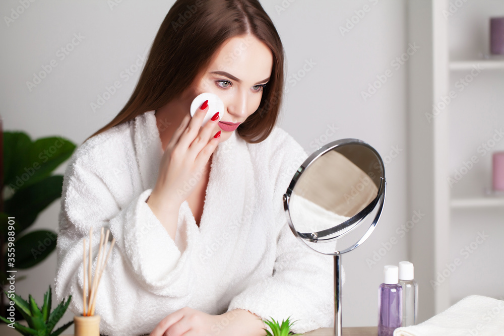 Beautiful girl with healthy skin makes makeup Beautiful girl with healthy skin makes makeup