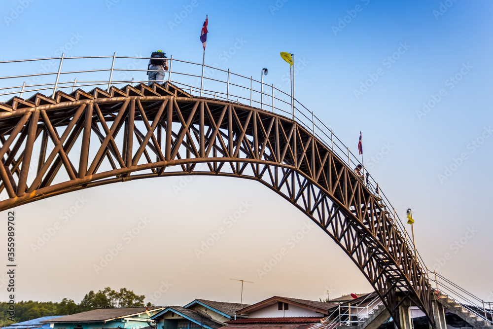 curved bridge over the river in the morning curved bridge over the river in the morning