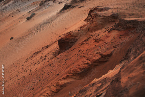 Red clay quarry. Clay quarry. Top view of a sand excavation site. Earth rocks are digging for building materials. Beautiful natural landscape to the land. Quarry with sand, sand loading, ground water,