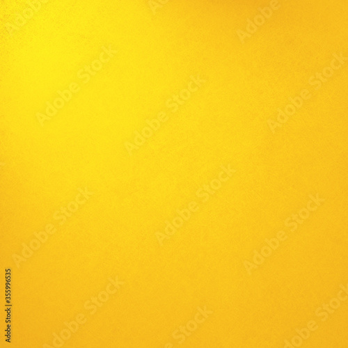 Yellow color background with texture, colorful bright gold wall or paper with corner spotlight and warm orange colour tone