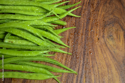Cluster Bean or  GuarAlso Known as Gavar, Guwar or Guvar Bean isolated on Wooden Background