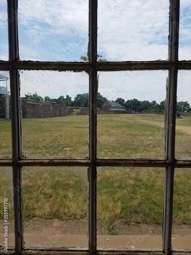 old window and grass field