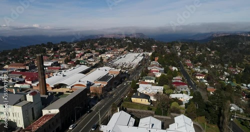 Katoomba town streets and houses in aerial flying to Echo point and Tree Systers rock formation.
 photo