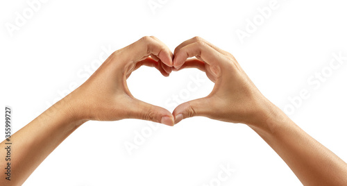 Female hands shaping a heart symbol on white background.