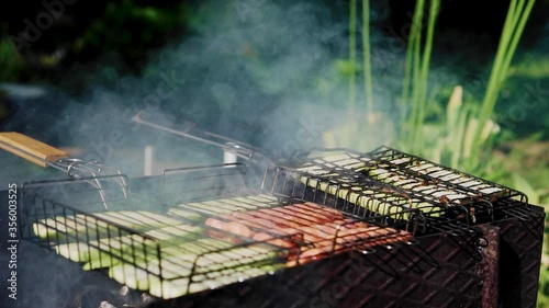 Summer barbecue. Sausages and vegetables languish in the Andes coals. Delicious food.
