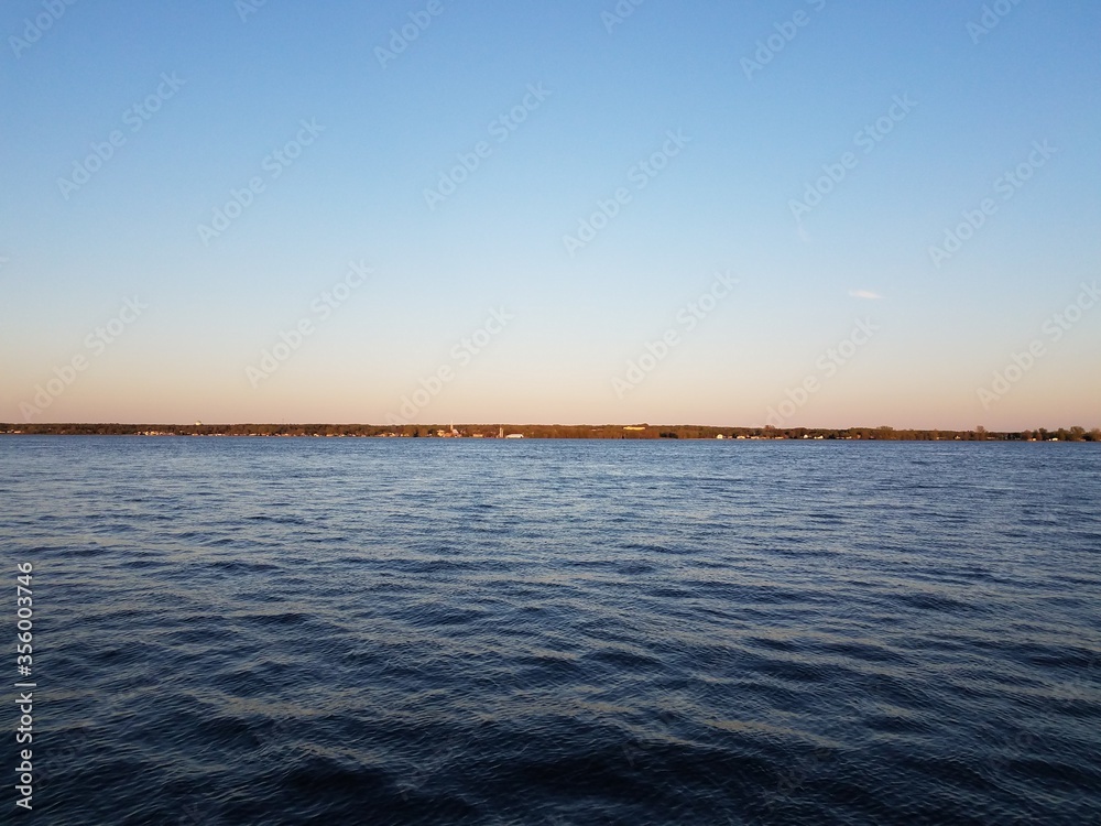 river water with waves and horizon and sky