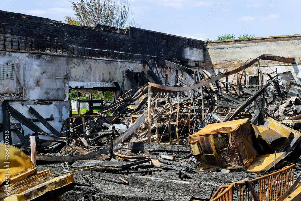 Fototapeta premium Businesses burned down damaged in Minneapolis Protest and Riots Fueled by the Death of Under Police