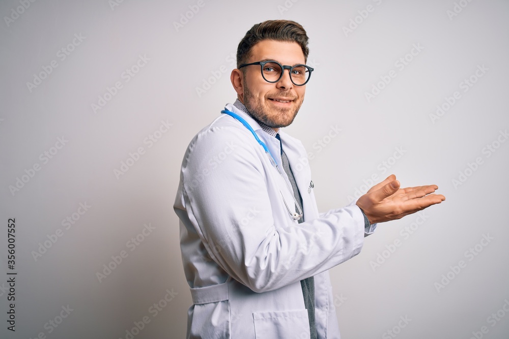 Young doctor man with blue eyes wearing medical coat and stethoscope over isolated background pointing aside with hands open palms showing copy space, presenting advertisement smiling excited happy Young doctor man with blue eyes wearing medical coat and stethoscope over isolated background pointing aside with hands open palms showing copy space, presenting advertisement smiling excited happy
