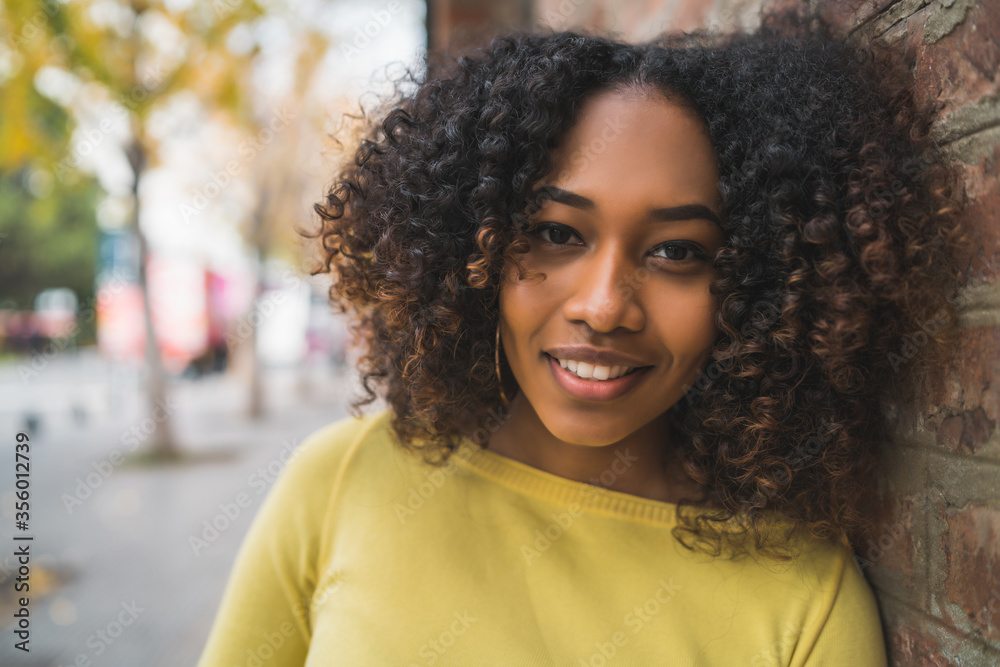 Portrait of Afro-american woman in the street. Portrait of Afro-american woman in the street.