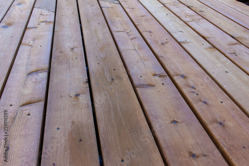 Close up abstract texture background of a newly constructed cedar wood deck floor, with copy space