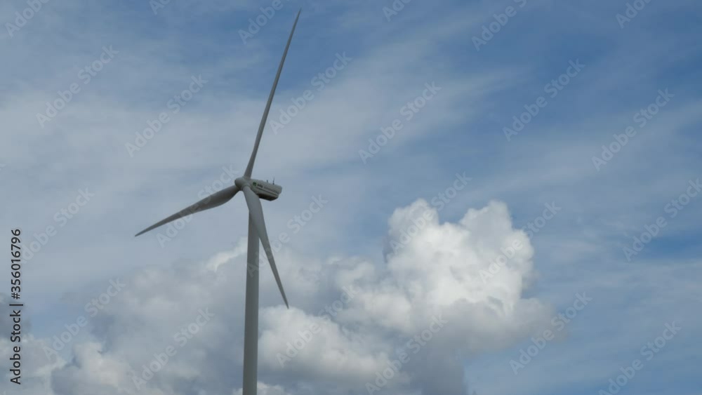 Close-up Side View of Wind Turbine Rotating Blades in Wind, Time Lapse Close-up Side View of Wind Turbine Rotating Blades in Wind, Time Lapse