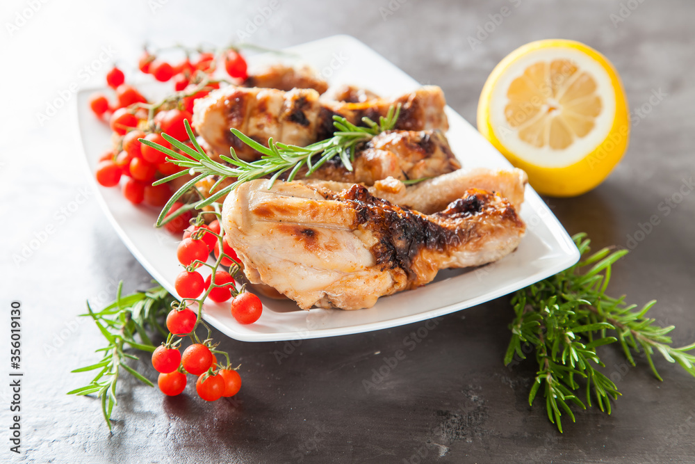chicken legs a grill with seasonings on a table, selective focus chicken legs a grill with seasonings on a table, selective focus