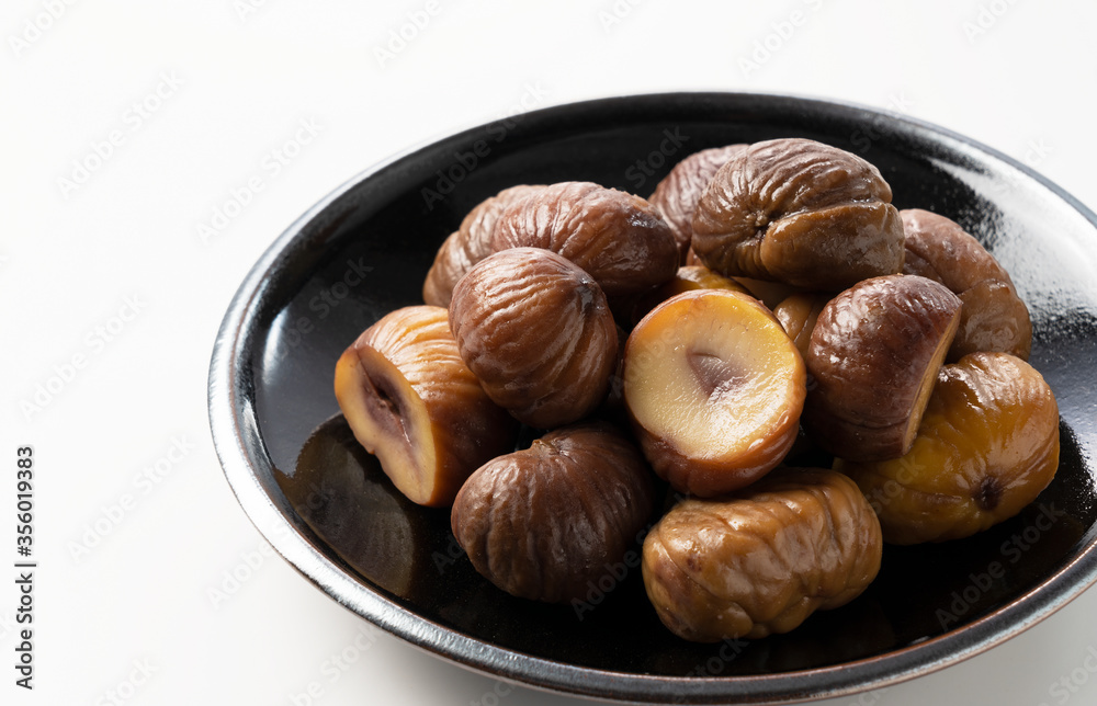 Peeled sweet chestnuts on a white background Peeled sweet chestnuts on a white background