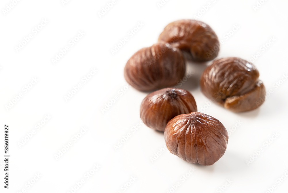 Peeled sweet chestnuts on a white background Peeled sweet chestnuts on a white background