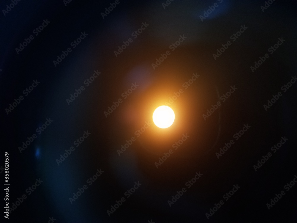 view of the sun through solar filter and binoculars
