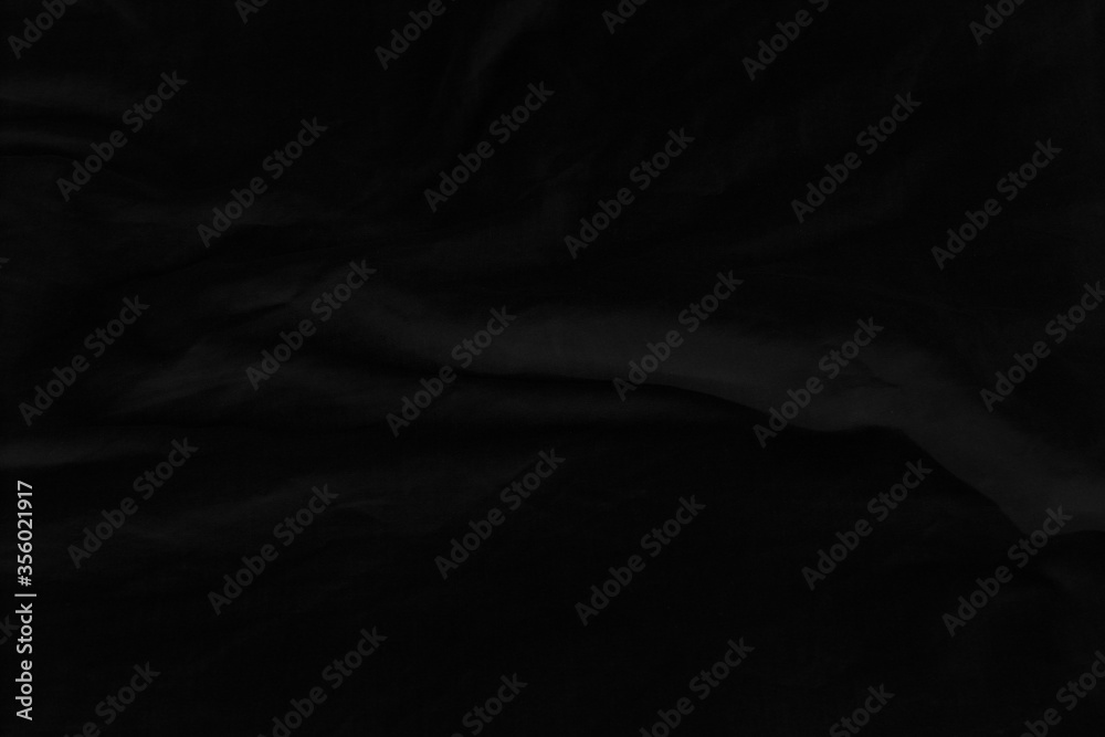 Black fabric texture for background; Abstract black fabric cloth wave or wavy folds texture material for background Black fabric texture for background; Abstract black fabric cloth wave or wavy folds texture material for background