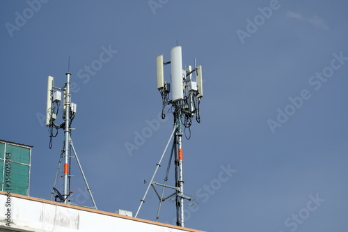 Telecommunication pole of 3G, 4G, 5G cellular antenna, small cell site base station on the rooftop of the building