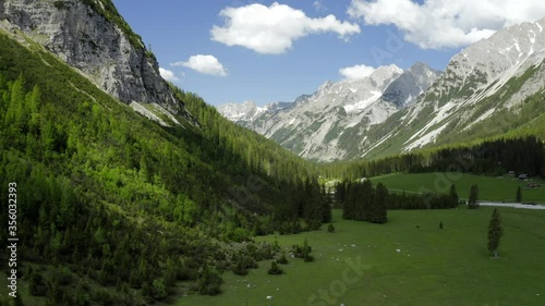 Beautiful Aerial shot flying into the karwendel Mountain Range on a bright sunny day