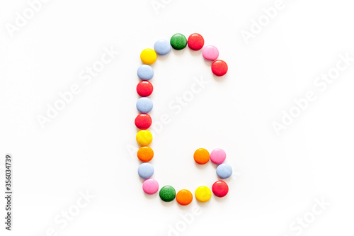 Candies font alphabet. Letter G isolated top view