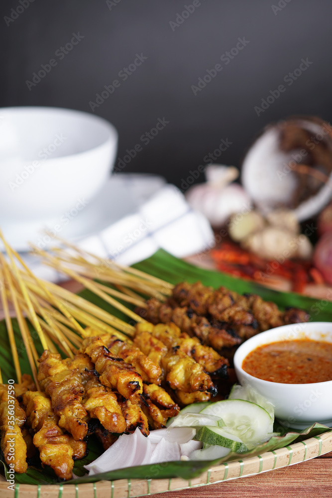Φωτογραφία Satay is a popular Malaysia / Indonesia dish of seasoned, skewered and grilled chicken and meat, served with peanut sauce