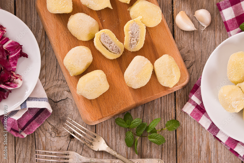 Potato gnocchi stuffed with radicchio and ricotta.
Potato gnocchi stuffed with radicchio and ricotta.