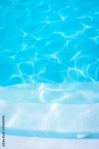 Clean and Bright Water in swimming pool. Abstract beautiful ripple wave and clear turquoise water surface in swimming pool, Turquoise or blue water wave for background and abstract