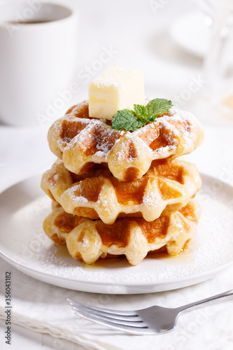 fresh baked waffles in a white plate