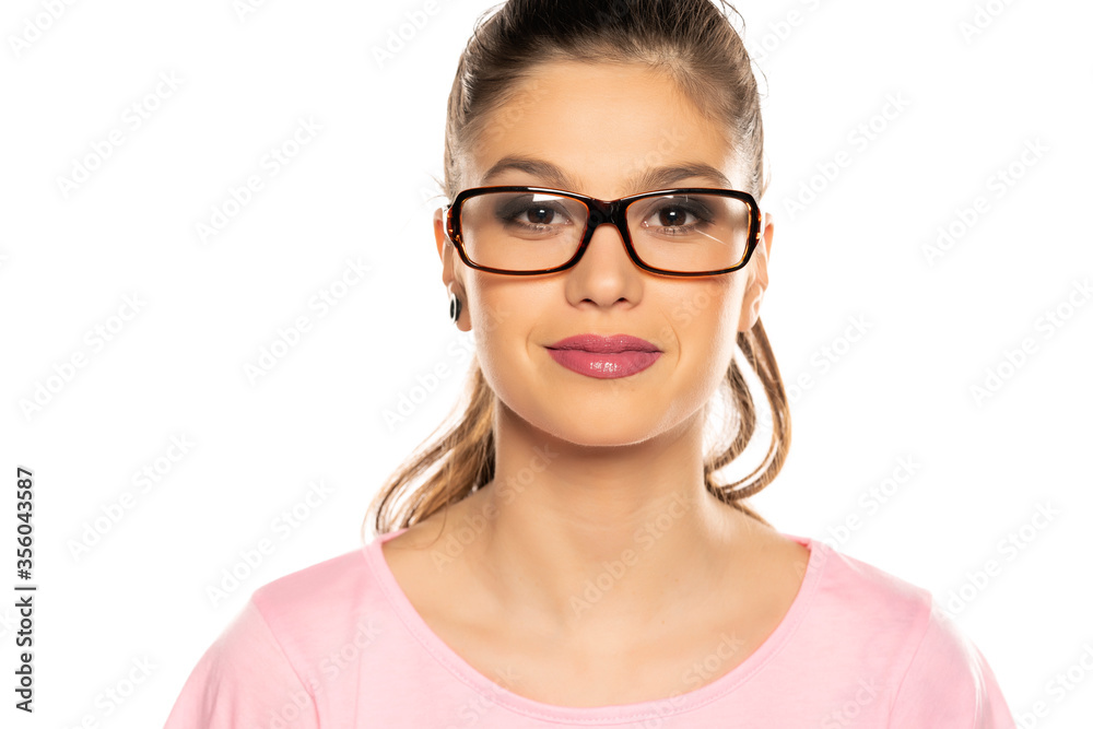 Portrait of young beautiful smiling woman with glasses