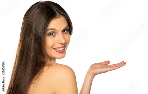 sensual portrait of beautiful young shirtless woman holding imaginary object