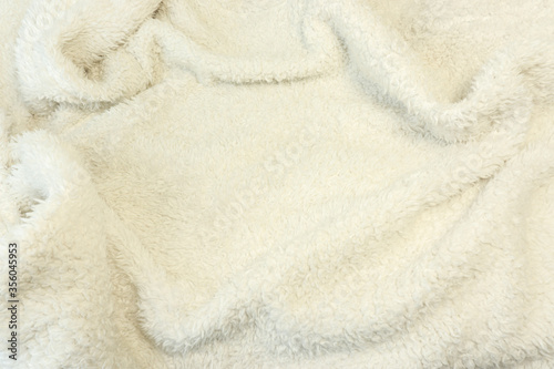 Full frame of drapery short fluffy fur soft white fabric.