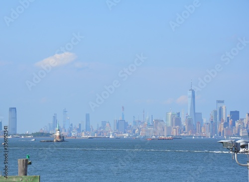 river water and statue of liberty and buildings in New York