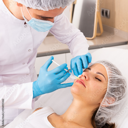 Woman receiving rejuvenating facial injections