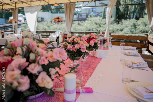 banquet table in a restaurant with flower decor