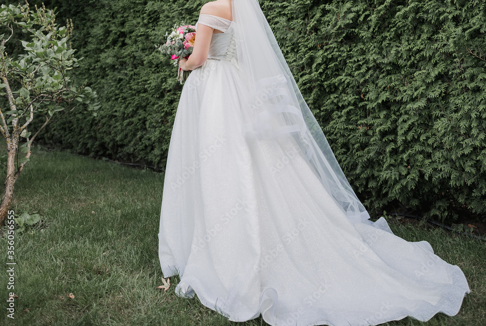 bride with a bouquet of flowers at a wedding bride with a bouquet of flowers at a wedding