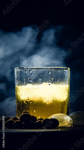 glass of beer on black background